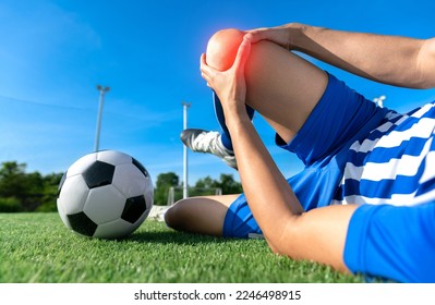 football soccer player accident knee injury sport football treatment on champion football league final match competition with ball on grass in stadium - Powered by Shutterstock