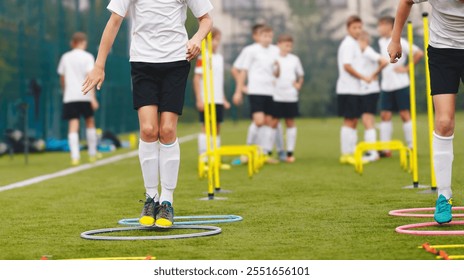 Football Soccer Skills. Soccer Training Session For Youth. Players Training on the Field. Soccer Obstacle Course. Grass Football Field. Coaching Soccer Gear Equipment for Field Training - Powered by Shutterstock