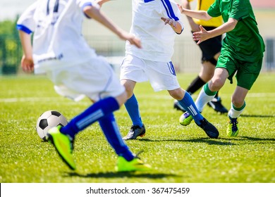 Football Soccer Tournament For Youth Teams. Soccer Football Training Camp For Kids, Children. Young Boys Playing Football Soccer Match.