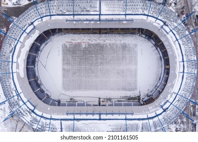 The Football Stadium Is Covered With Snow In Winter. Cleaning And Preparation For Sports Performances. Bad Weather. Drone Photo