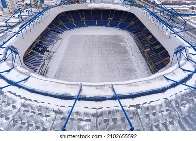 The Football Stadium Is Covered With Snow In Winter. Cleaning And Preparation For Sports Performances. Bad Weather. Drone Photo