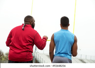 Football Training Day. American Football.  Football Coach Training An Athlete. 