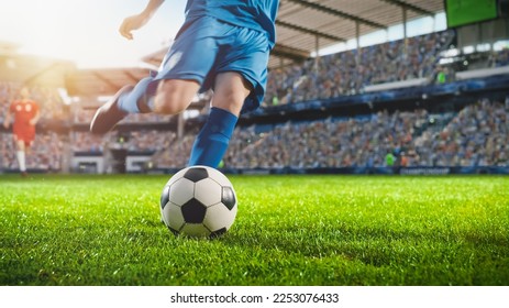 Football World Championship: Soccer Player Runs to Kick the Ball. Ball on the Grass Field of Arena, Full Stadium of Crowd Cheers. International Tournament Concept. Cinematic Shot Captures Victory. - Powered by Shutterstock