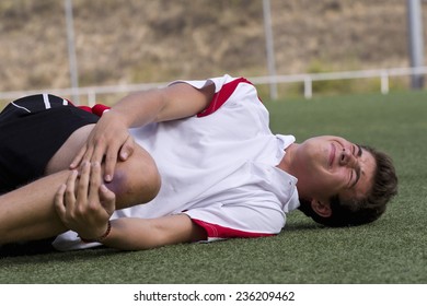 Footballer faking an injury - Powered by Shutterstock