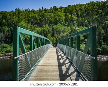 Footbridge At The Beginning Of The Fjord Hiking Trail In Sacré Coeur, In Saguenay National Park (Quebec, Canada)