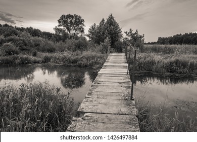 Footbridge over the river - black & white photography