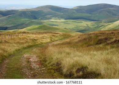 Footpath Across Rolling Hills In Northumberland National Park