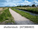 footpath along a canal in Vihiluoto Kempele, Finland