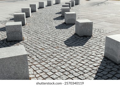 A footpath bordered with stone blocks in a public square