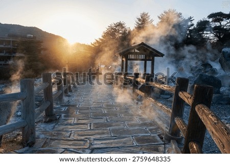 Footpath of Hell valley Jigoku of Mount Unzen onsen hot springs by ryokan hotel at sunset, Nagasaki, Japan. travel destination for hot spring water and gas by volcanic field.
