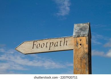 Footpath Sign Against Blue Sky