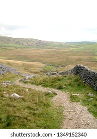Footpath and stone wall