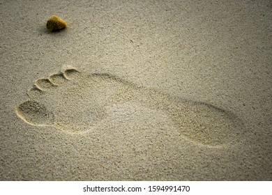 Footprint Inside White Sand On The Beach Created When People Walking Barefoot On The Exotic Coastline