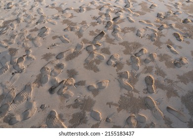 Footprint on beach. Shoes print on sand. Messy beach. Busy beach destination. Summer is here. Island destination. Beach vacation.