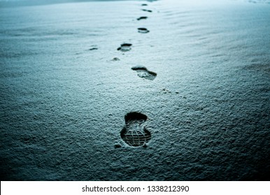 Footprint on snow texture in the winter night.Foot mark on the snow. Foot mark on the snow.
