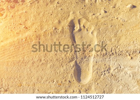 The footprint on yellow sand, the substrate for the Internet and travel articles