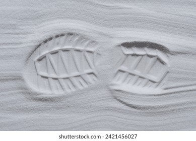 Footprint of shoe in the white sand - Powered by Shutterstock