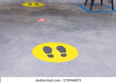 Footprint sign for stand in the mall.Social Distance word sticker poster.Social Distancing 6 Ft. Instruction against the Spread.New normal Reopen Mall.Social distancing in the workplace during covid19 - Shutterstock ID 1739968073