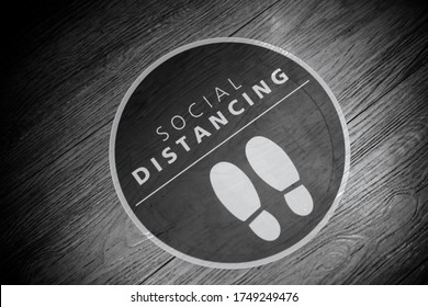 Footprint sign for stand in the mall.Social Distance word sticker poster.Social Distancing 6 Ft. Instruction against the Spread.New normal Reopen Mall.Social distancing in the workplace during covid19 - Shutterstock ID 1749249476