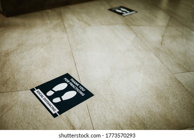 Footprint Sign For Stand In The Mall.Social Distance Word Sticker Poster.Social Distancing 6 Ft. Instruction Against The Spread.New Normal Reopen Mall.Social Distancing In The Workplace During Covid19