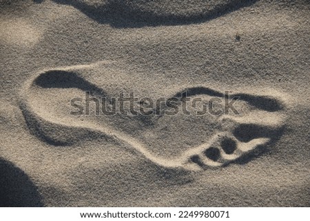Footprints from bare foot in the sand 