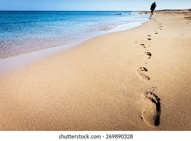 Footprints on beach - Powered by Shutterstock