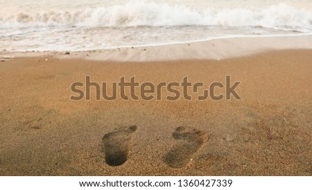 Footprints in the sand. Finike, Near Antalya, Turkey. The picture was taken in Turkey in July of 2018