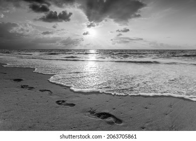 Footprints In The Sand Ocean Sunset In Black And White Image Format