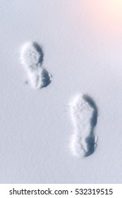 Footprints In Snow.