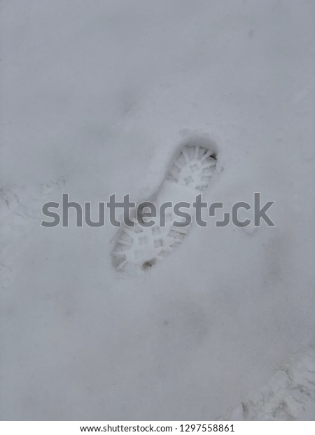 Footprints in snow in\
the winter\
time-Image