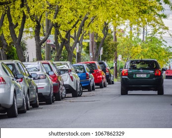 Footscray, VIC/Australia-Oct 19th 2017: Car Running On Melbourne's Suburban Street With Family Cars Parked Along The Road.