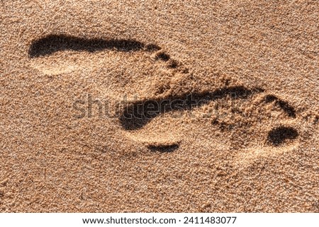 footsteps in the sand on the beach, on Ballito Bay, Durban