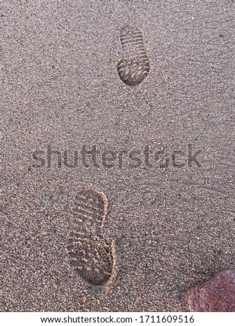 Footsteps walking on the beach