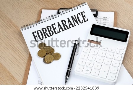 FORBEARANCE text on notebook with chart and calculator and coins, business concept