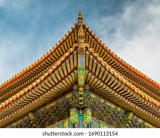 Forbidden City, Beijing, China - April 20, 2017 - Detail of a traditional golden yellow ornamental roof in the Forbidden City.