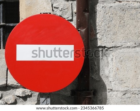 forbidden direction for all drivers red sign. Do not enter