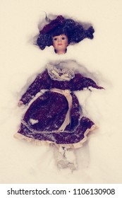 Forbidden Games. Abandoned Doll With Head Separated From The Body In The Snow. No People