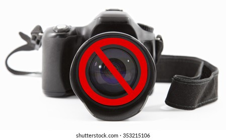 Forbidden sign on a camera lens as a concept of photos forbidden
