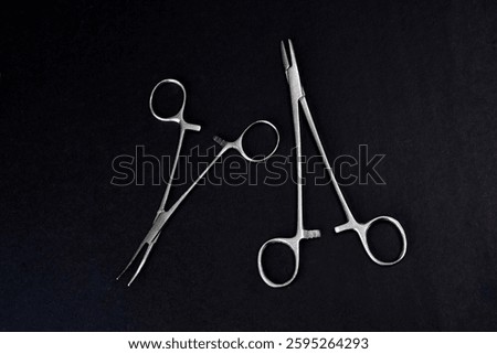 Forceps tool. Kelly forceps scissors. Stainless steel hemostatic surgical forceps with locking clamps. Curved fishing pliers; straight tip. Fishing hook extractor. Medical instrument; supply