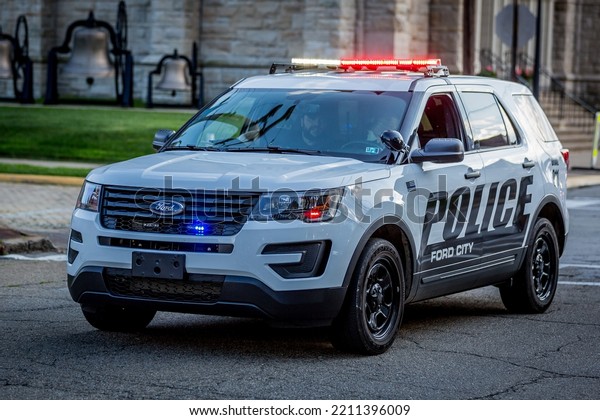 Ford City, Pa., USA - September 2, 2018:  Ford City\
Labor Day Parade.  Police cars lead the way in the Labor Day Parade\
in Ford City.