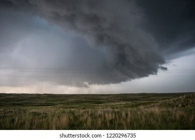 Foreboding scary thunderstorm building over open farmland over USA on spring afternoon - Shutterstock ID 1220296735