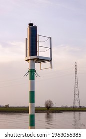 Forecast Weather Air Pressure Wind Data Collection Mast Station On The Edge Of River IJssel Against A Blue Sky With Clouds At Sunset And Electricity Tower In The Background