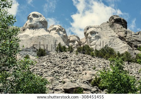 The forefathers on Mount Rushmore - George Washington, Thomas Jefferson, Theodore Roosevelt, and Abraham Lincoln - overlook the Black Hills of South Dakota.