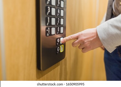 Forefinger Pressing Door Closing Button In The Elevator.