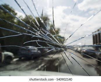 in the forefront the broken car glass, on a background it is expensive