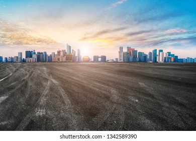 Foreground highway asphalt pavement city building commercial bui - Shutterstock ID 1342589390