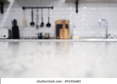 Foreground Of Kitchen Island And Blurry Background Of Kitchen Counter