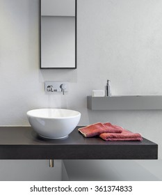 Foreground Of Washbasin On The Wooden Worktop In The Modern Bathroom