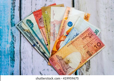 Foreign Currency Banknotes On Wooden Floor
