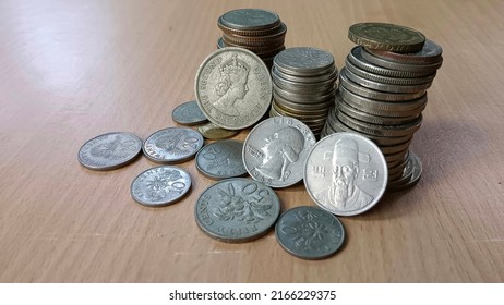 Foreign Currency Coins On The Table.